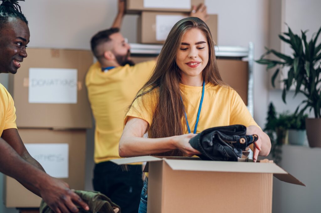 Portrait of a woman volunteer working in community charity donation center